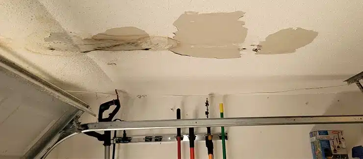 ceiling showing moisture damage from elevated indoor humidity and hidden wall moisture
